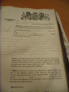 A Victorian era parking ticket: printed text in fancy font with handwritten violations.