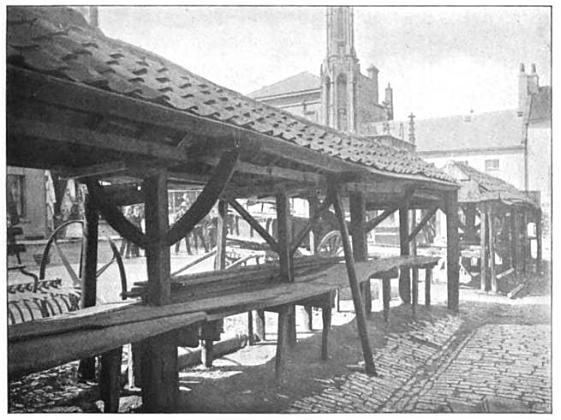 A black and white photograph of the decaying "shambles"--medieval booths for selling articles