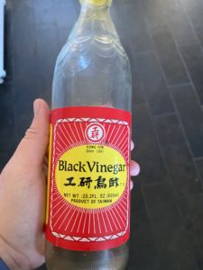 A bottle labeled “black vinegar”