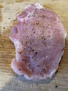 A pork cutlet, beaten into submission, salted and peppered