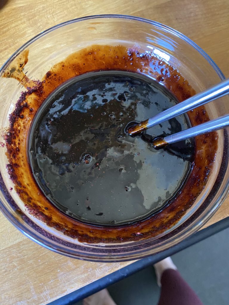 A picture of a dark reddish-brownish sauce