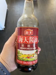 A bottle labeled “superior dark soy sauce.”